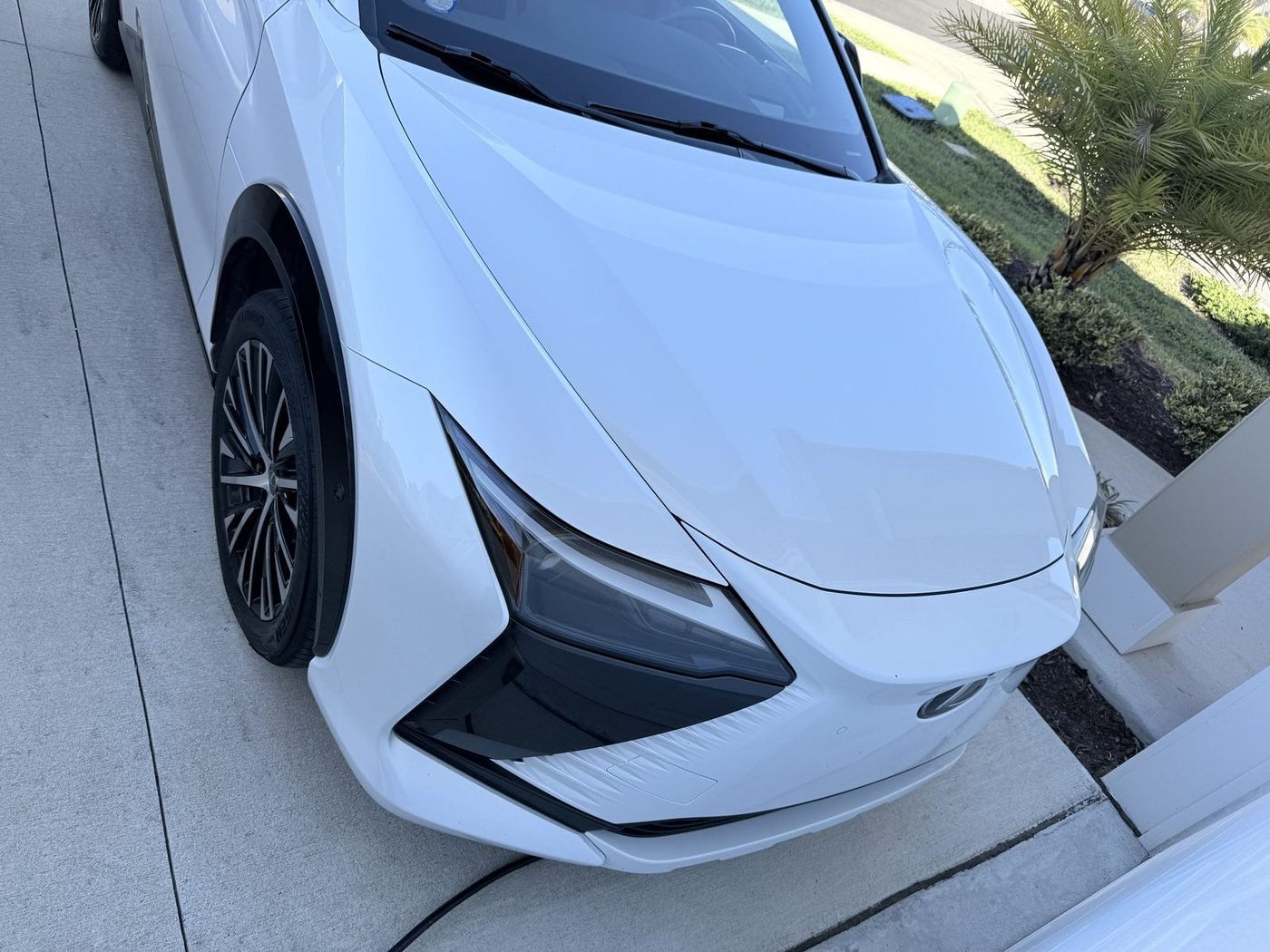 Lexus RZ 450e parked at a home in Beacon Lake, St. Johns County, FL after Pure Power Electrical installed its outdoor Level 2 EV charger