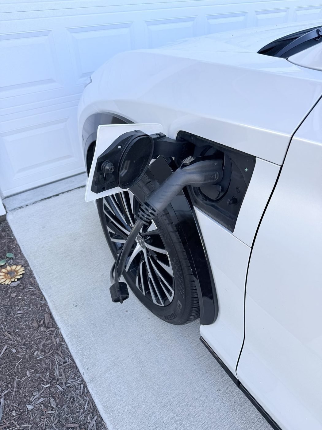 Lexus RZ 450e charging from a outdoor Level 2 EV charger installed by Pure Power Electrical in Beacon Lake, St. Johns County, FL