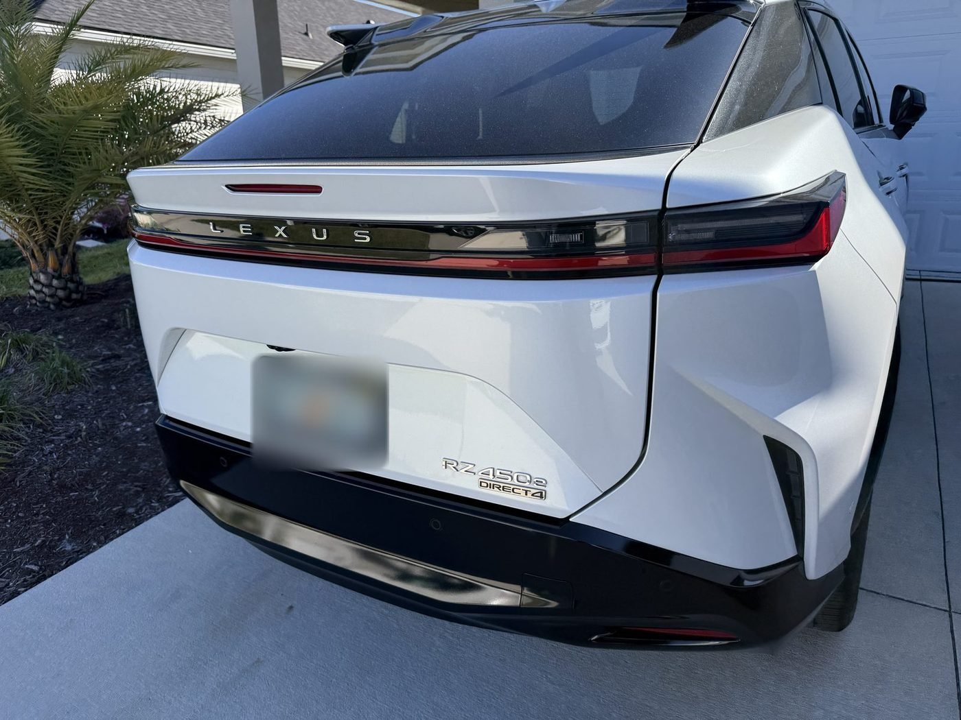 Lexus RZ 450e parked at a home in Beacon Lake, St. Johns County, FL after Pure Power Electrical installed its outdoor Level 2 EV charger