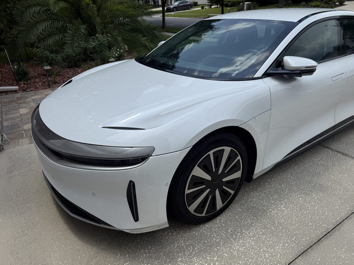 Lucid Air parked at a home in Greenleaf Village, Nocatee, FL after Pure Power Electrical installed its Tesla Universal Wall Connector