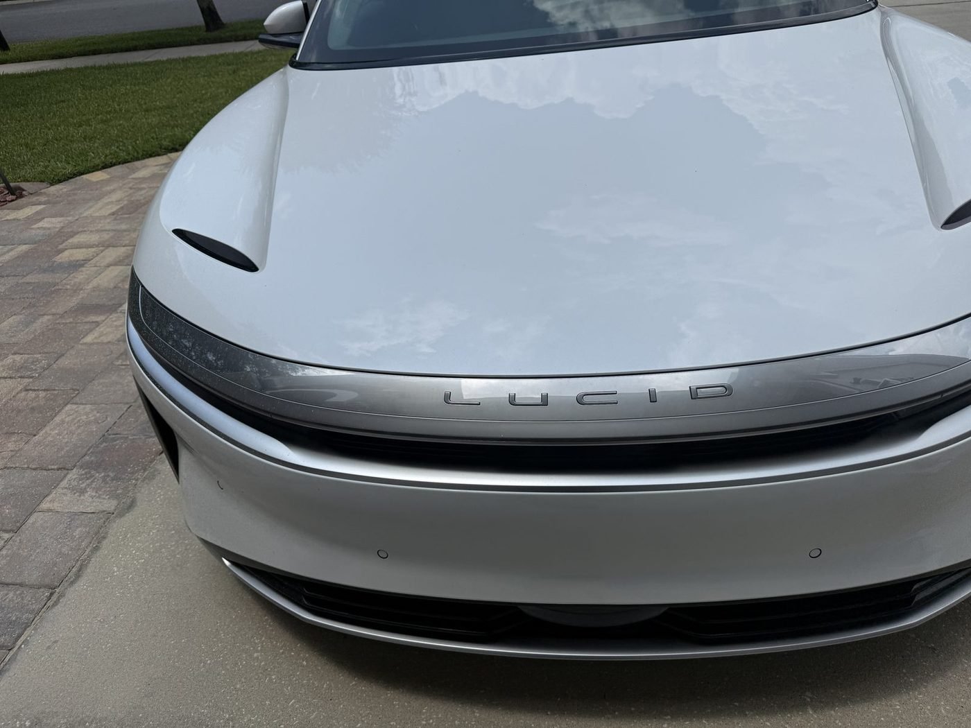 Lucid Air parked at a home in Greenleaf Village, Nocatee, FL after Pure Power Electrical installed its Tesla Universal Wall Connector
