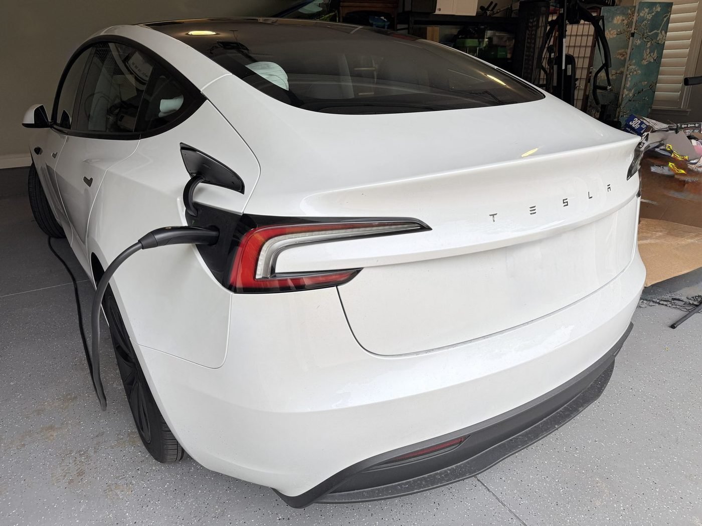 Tesla Model 3 charging from a Tesla Wall Connector installed by Pure Power Electrical in Pablo Creek Reserve, Jacksonville, FL