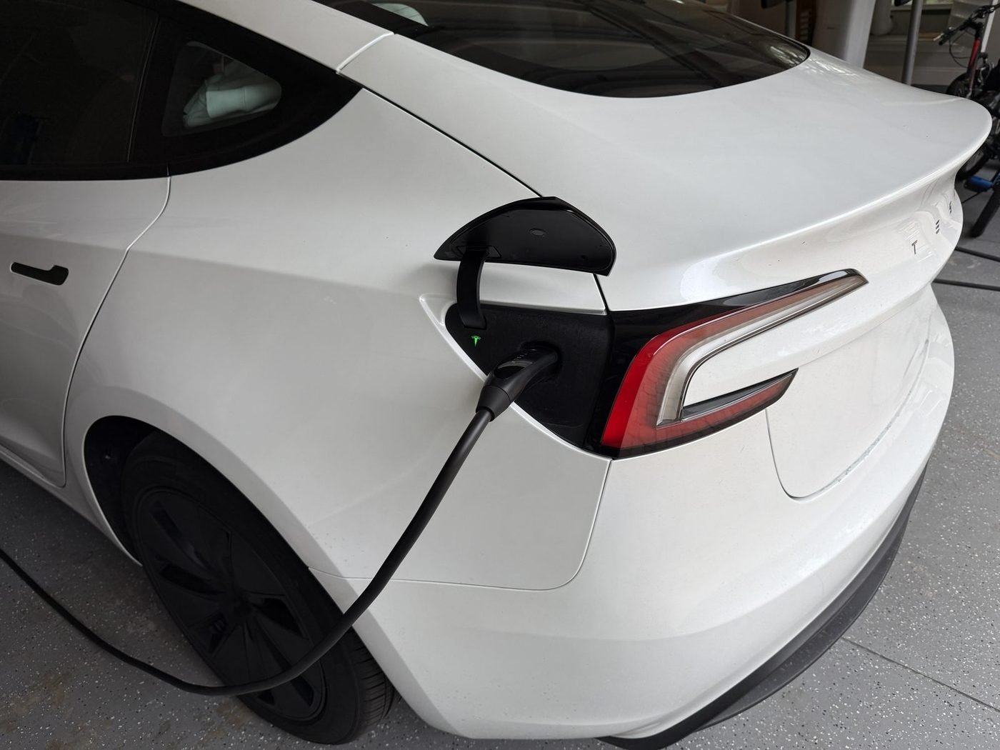 Tesla Model 3 charging from a Tesla Wall Connector installed by Pure Power Electrical in Pablo Creek Reserve, Jacksonville, FL