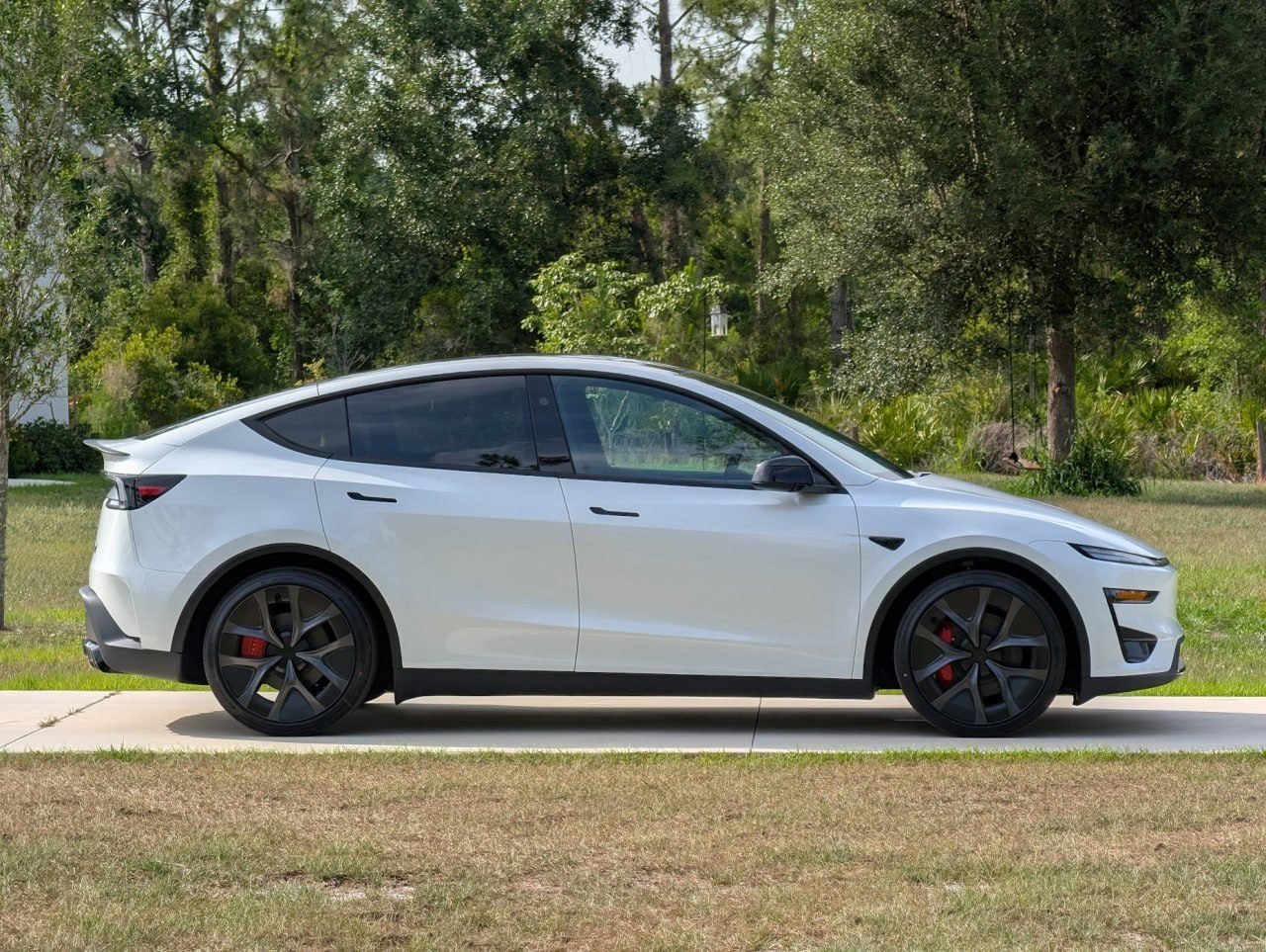 Tesla Model Y at a customer home with a Level 2 EV charger installed by Pure Power Electrical