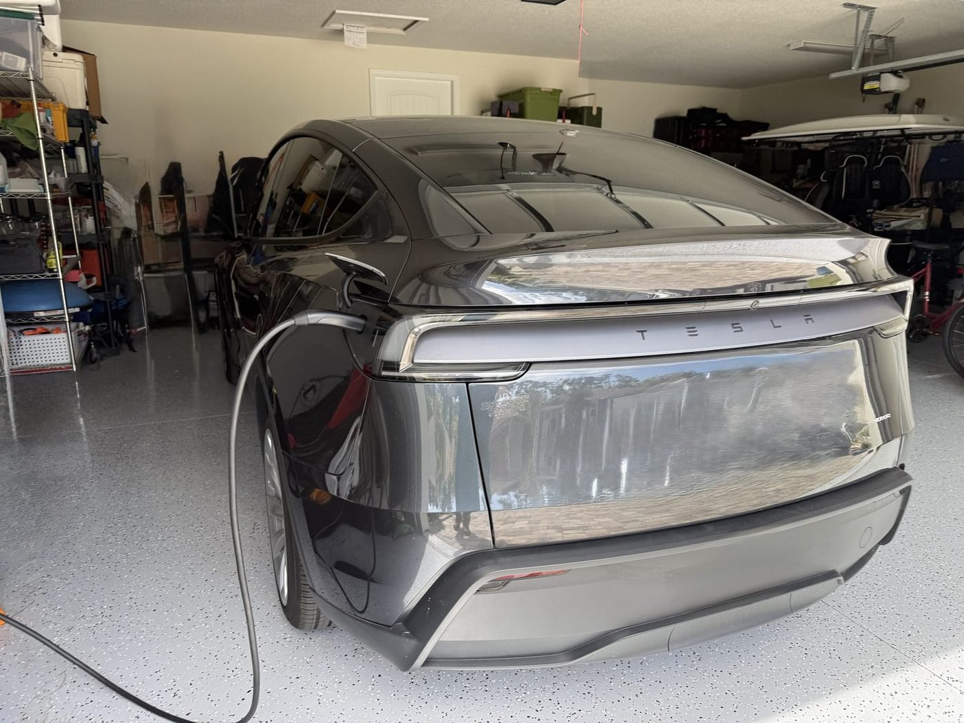 Tesla Model Y charging from a Level 2 EV charger installed by Pure Power Electrical in Deep Creek Landing, Nocatee, FL