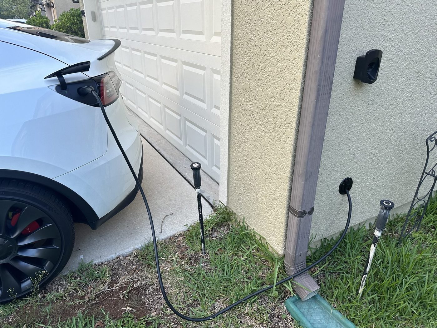 Tesla Model Y charging from a Level 2 EV charger installed by Pure Power Electrical in Flagler Station, Jacksonville, FL