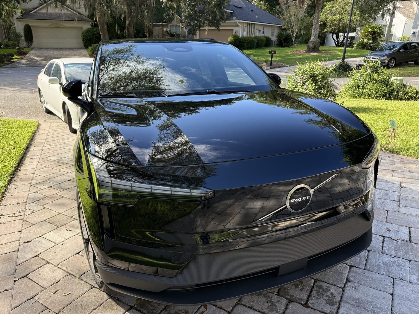 Volvo EX30 parked at a home in East Hampton in Baymeadows, Jacksonville, FL after Pure Power Electrical installed its Tesla Universal Wall Connector and surge protector