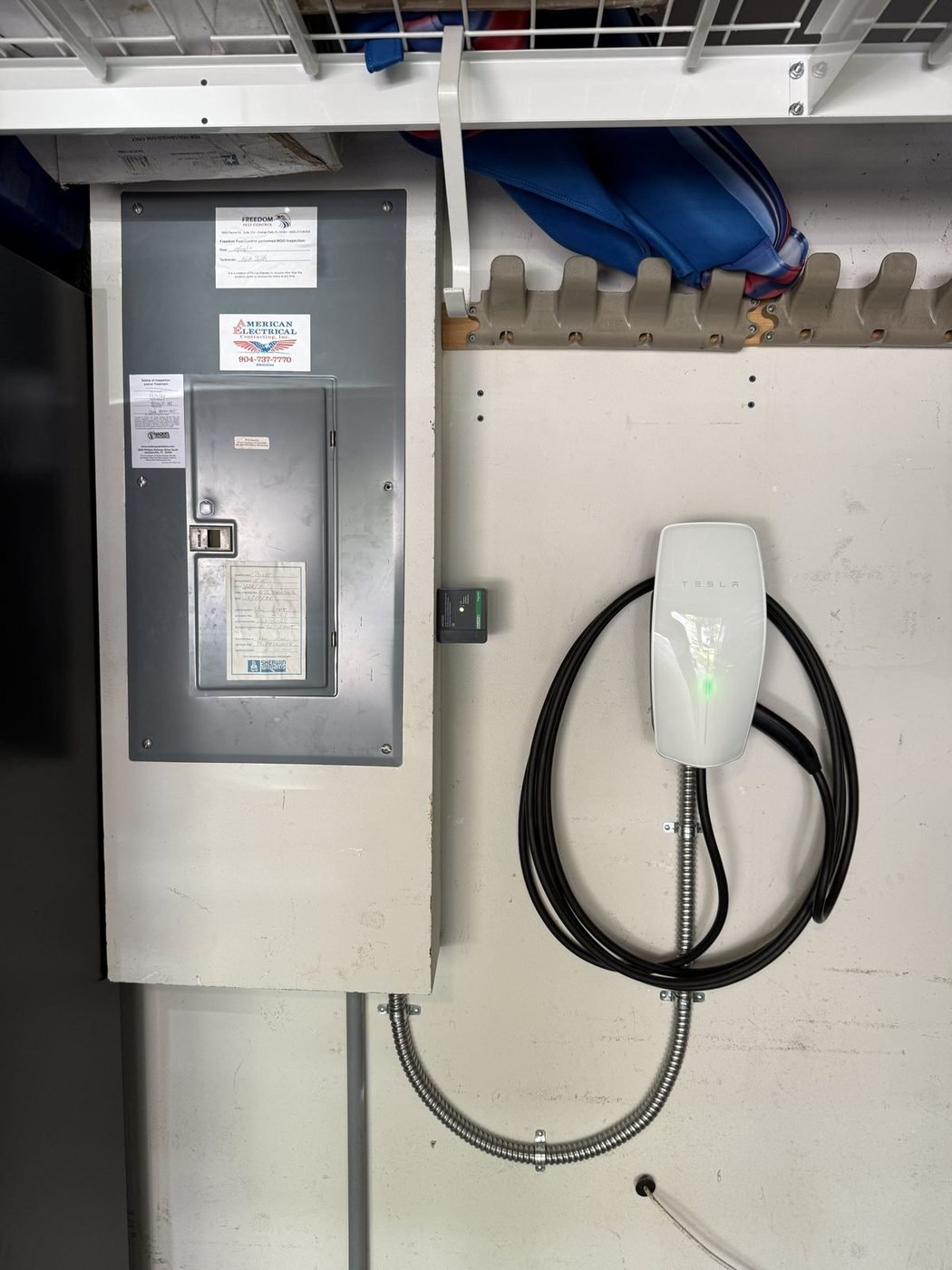 Tesla Universal Wall Connector and surge protector installed by Pure Power Electrical in East Hampton in Baymeadows, Jacksonville, FL