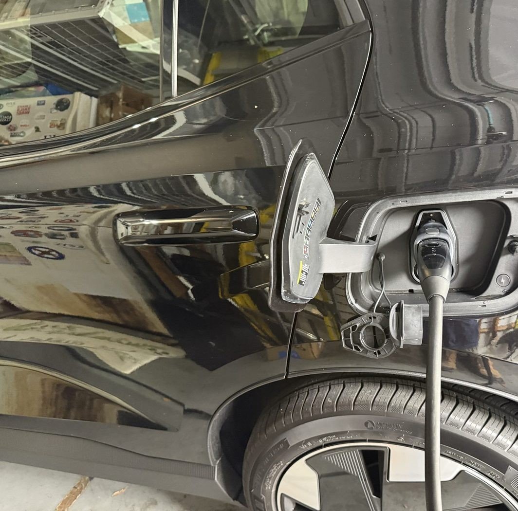 Volvo EX30 charging from a Tesla Universal Wall Connector and surge protector installed by Pure Power Electrical in East Hampton in Baymeadows, Jacksonville, FL