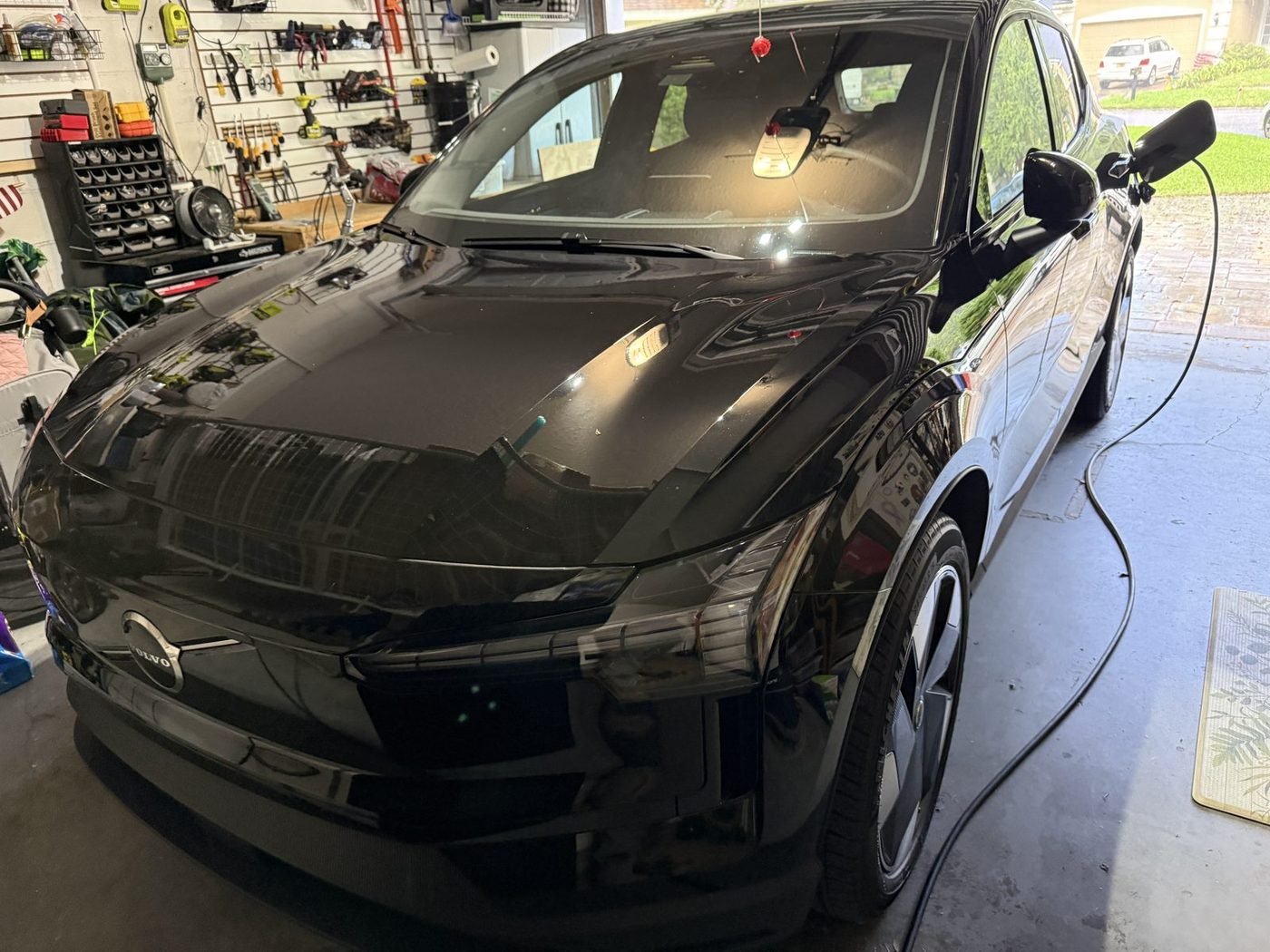 Volvo EX30 charging from a Tesla Universal Wall Connector and surge protector installed by Pure Power Electrical in East Hampton in Baymeadows, Jacksonville, FL